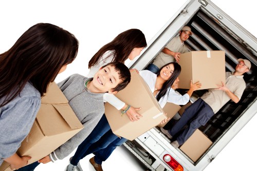 Professional team handling furniture pick-up in Catford storage