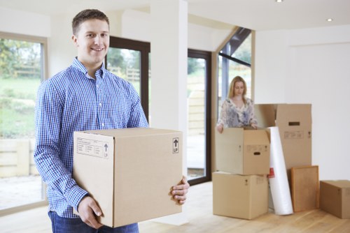 Professional movers assisting with a household move in Catford