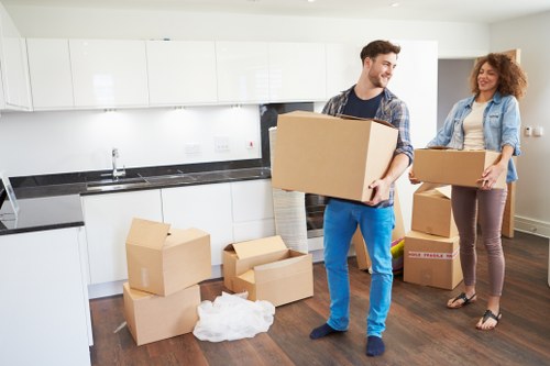 Professional movers handling residential items